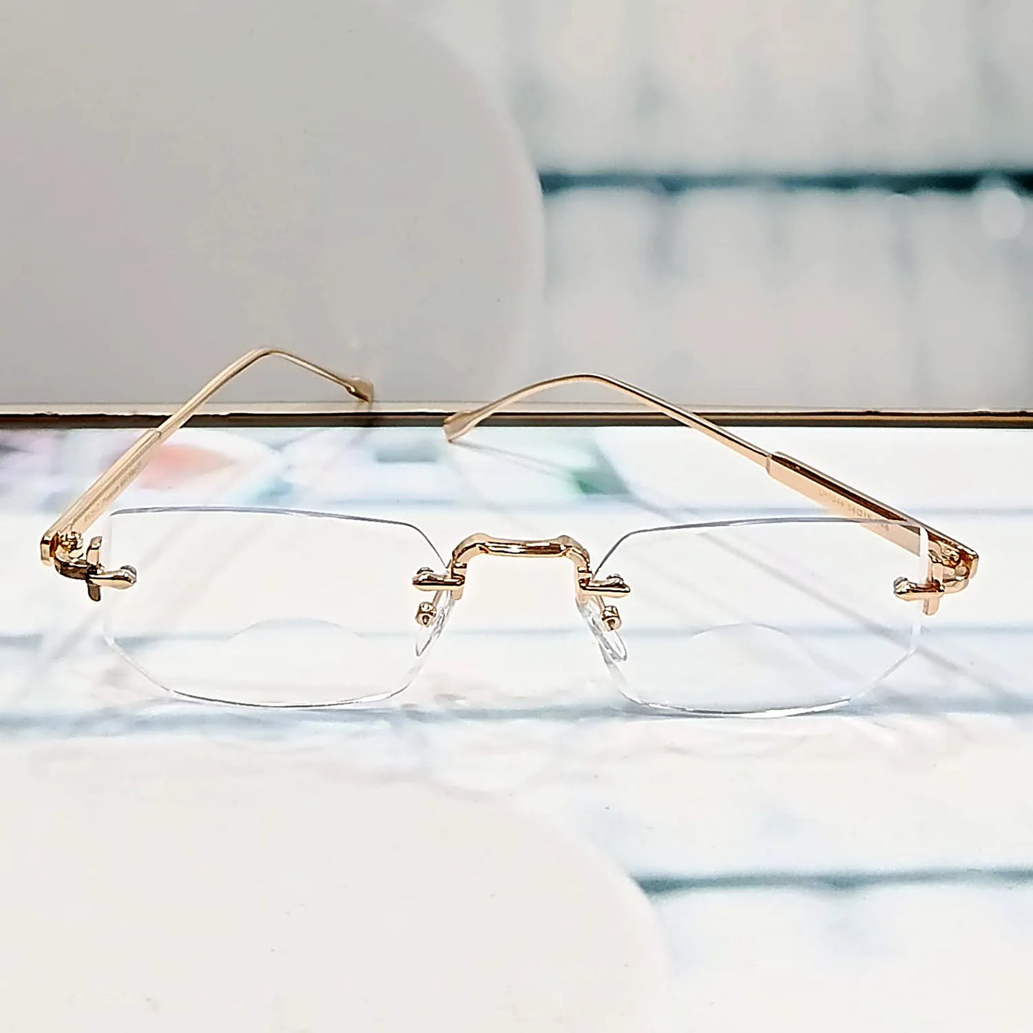 Nine Optic N-102 Elite Gold gold rimless reading glasses — front straight view
