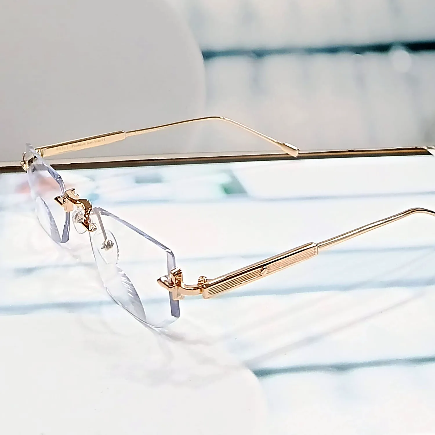N-102 Elite Gold gold rimless reading glasses — front view