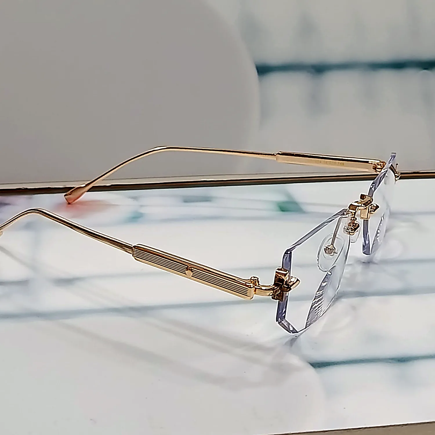 N-102 Elite Gold gold rimless reading glasses — side view with engraved gold temple