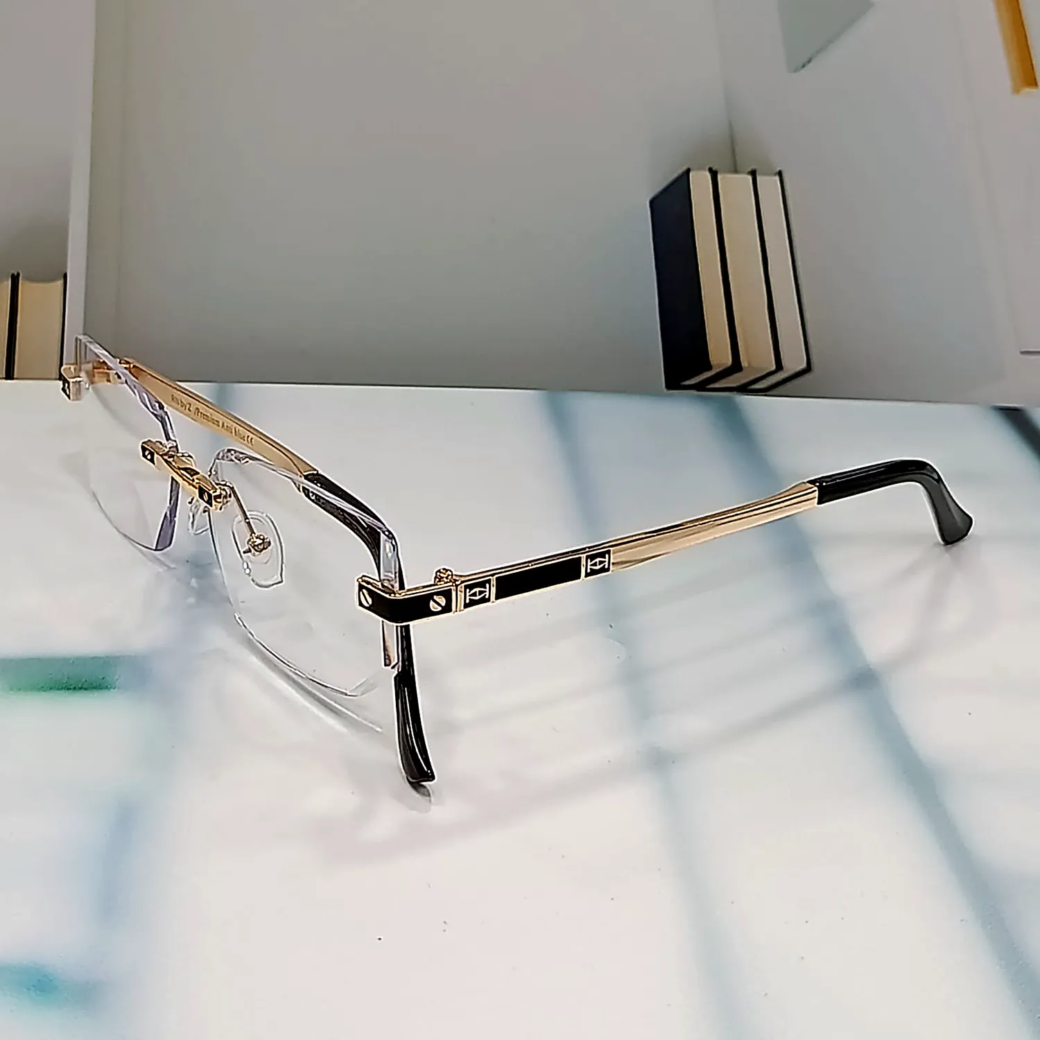 N-103 Regent Gold rimless reading glasses in gold — front angled view